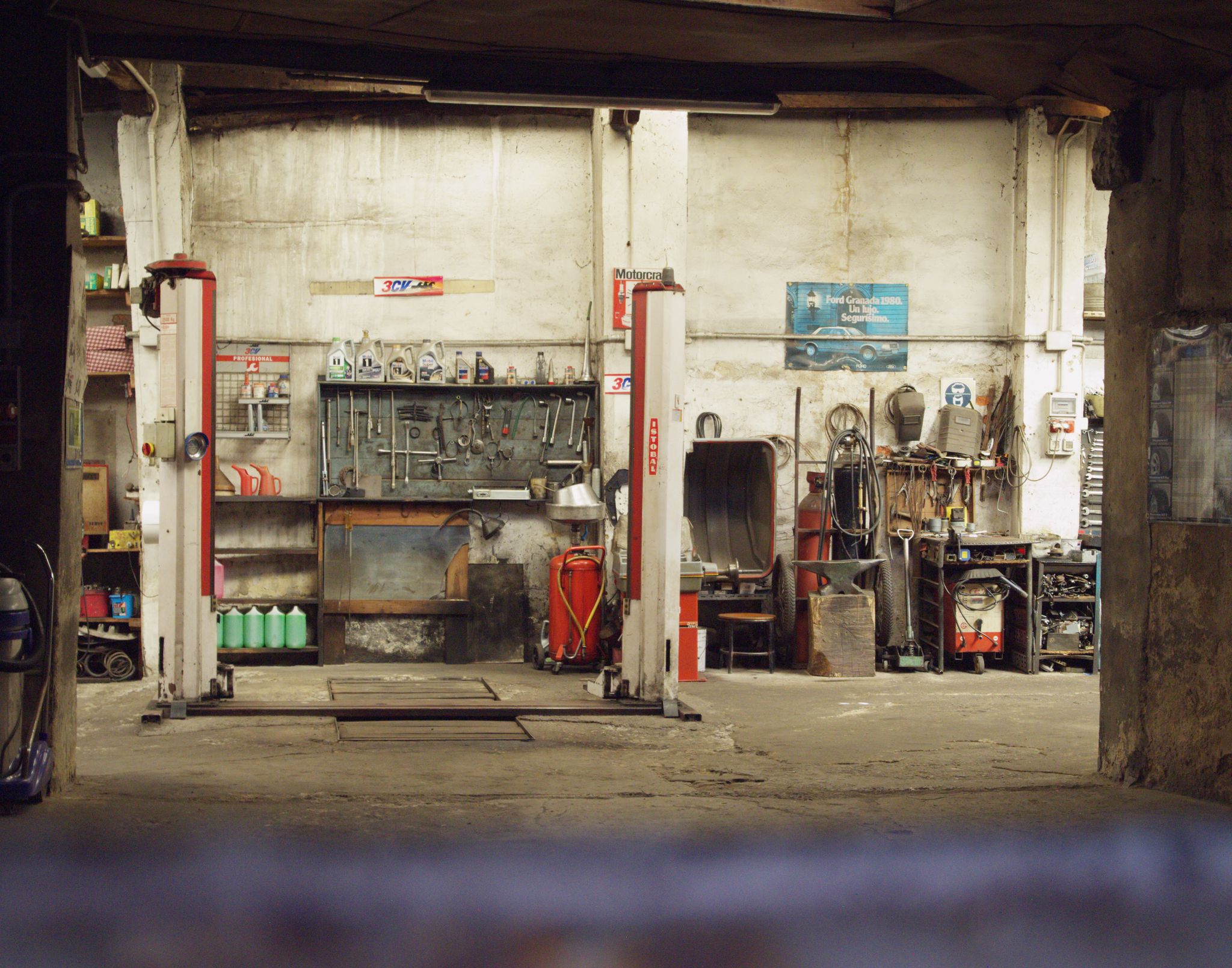 Mechanic working on a car in a garage