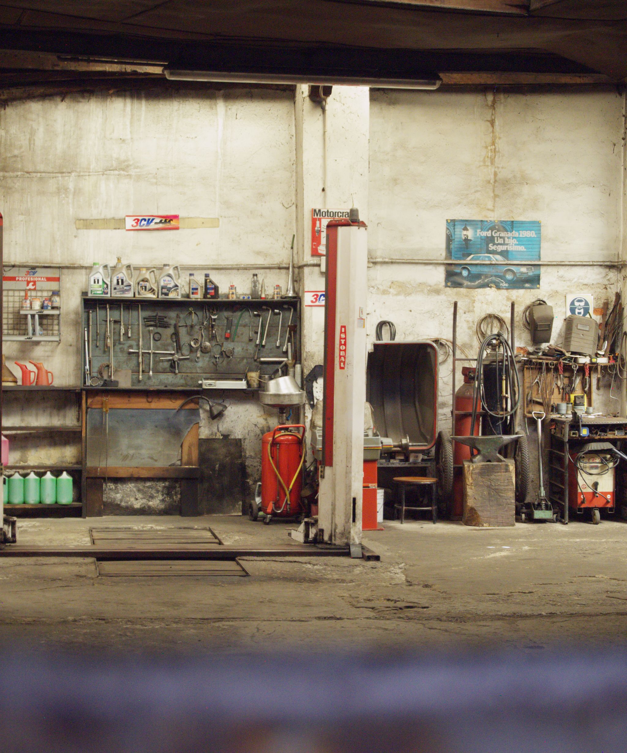 Mechanic working on a car in a garage
