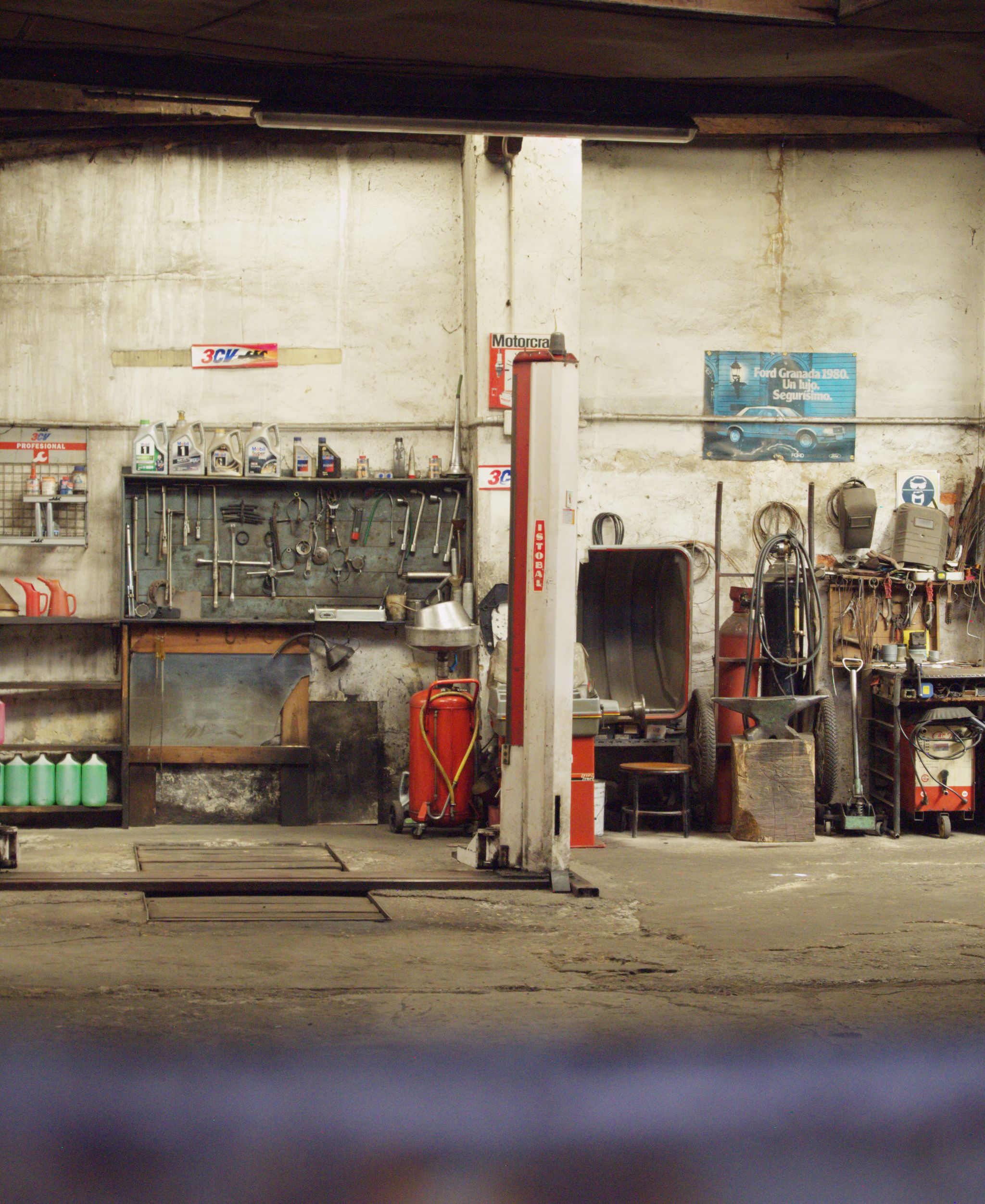 Mechanic working on a car in a garage