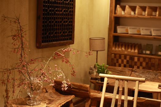 Warm and inviting rustic interior featuring floral decor and wooden furniture.