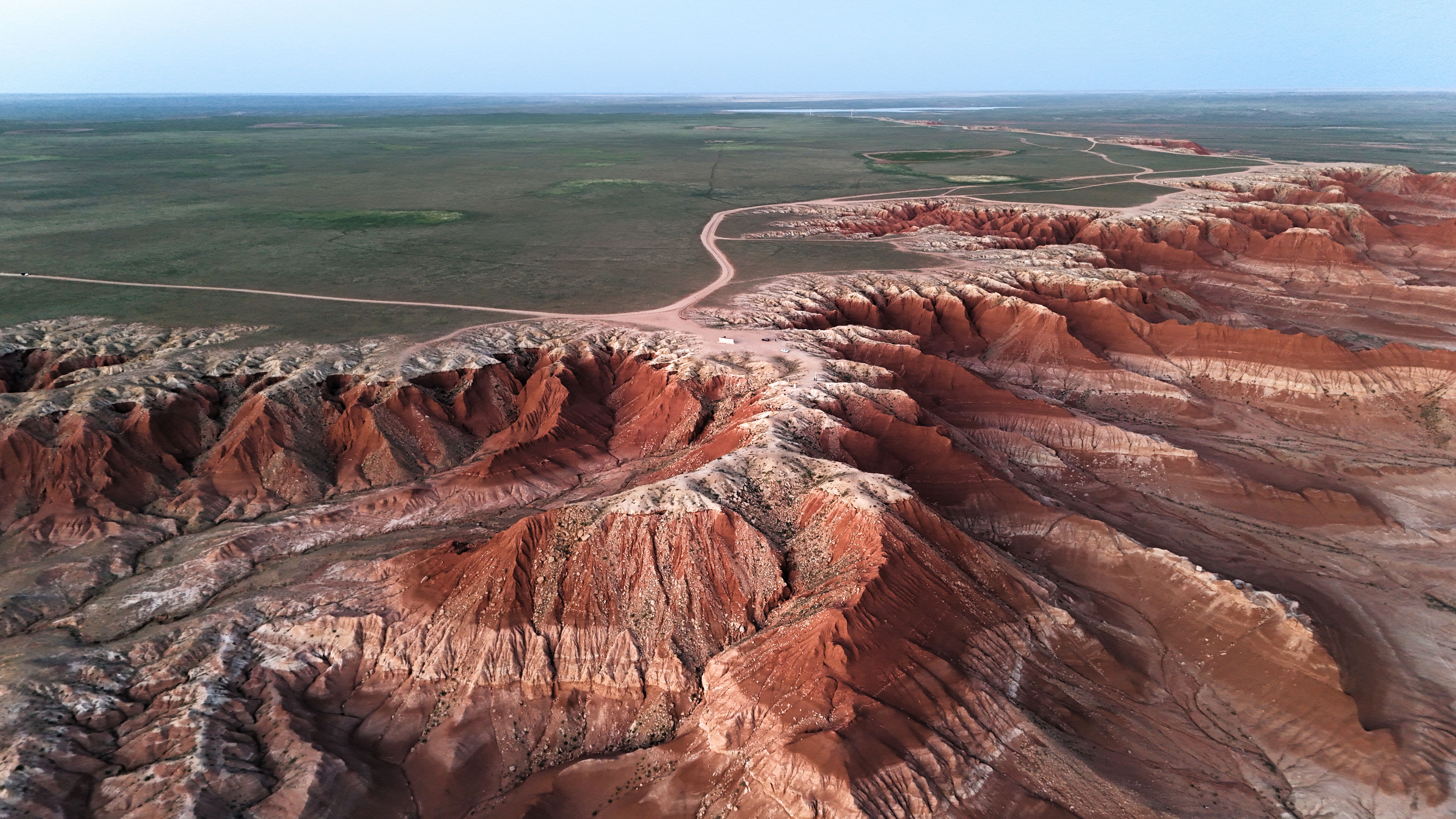 Stunning aerial photo of red rock formations in Gobi Desert, Mongolia.