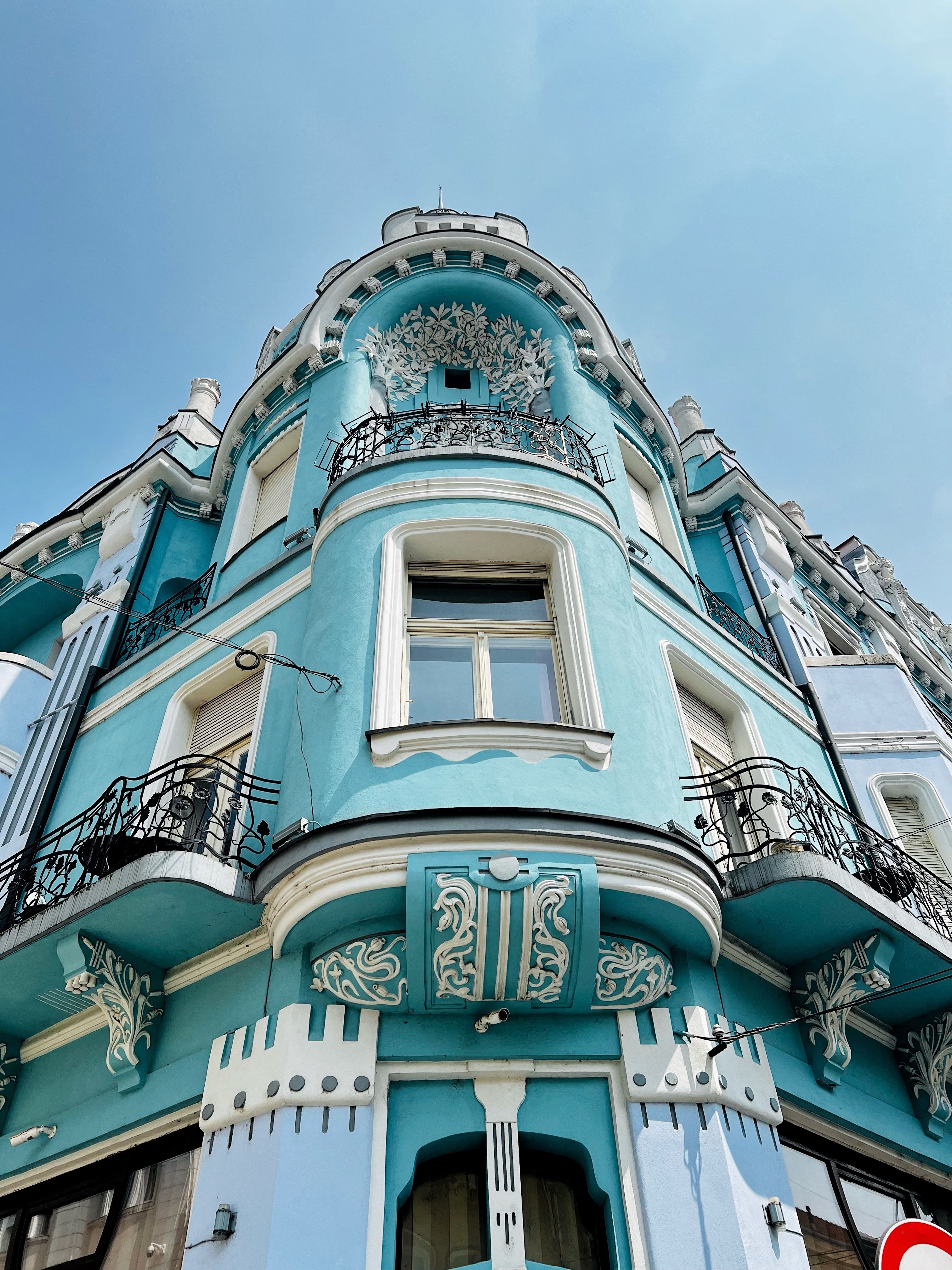 Elegant blue Art Nouveau style building showcasing ornate architectural details.. elegant, blue, nouveau