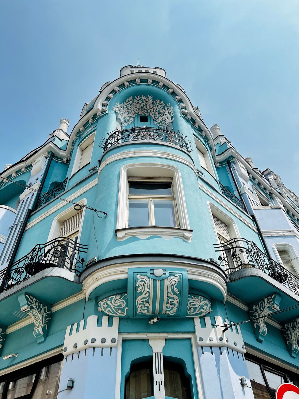 Elegant blue Art Nouveau style building showcasing ornate architectural details.. elegant, blue, nouveau