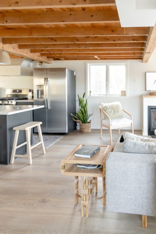 Free A bright and modern minimalist living area with wooden elements and cozy decor. Stock Photo