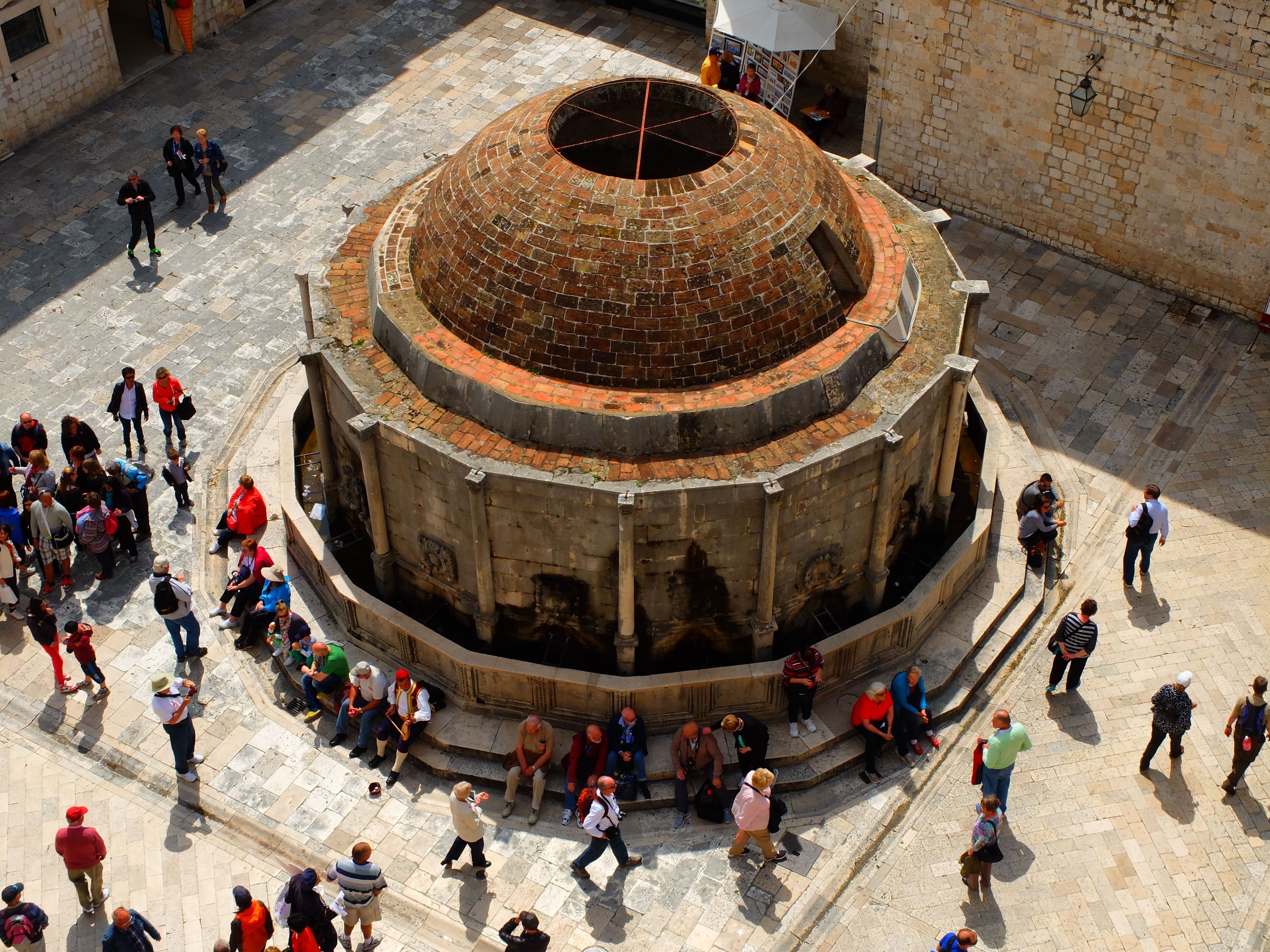 Aerial view of Onofrio's Fountain with tourists in Dubrovnik, Croatia.