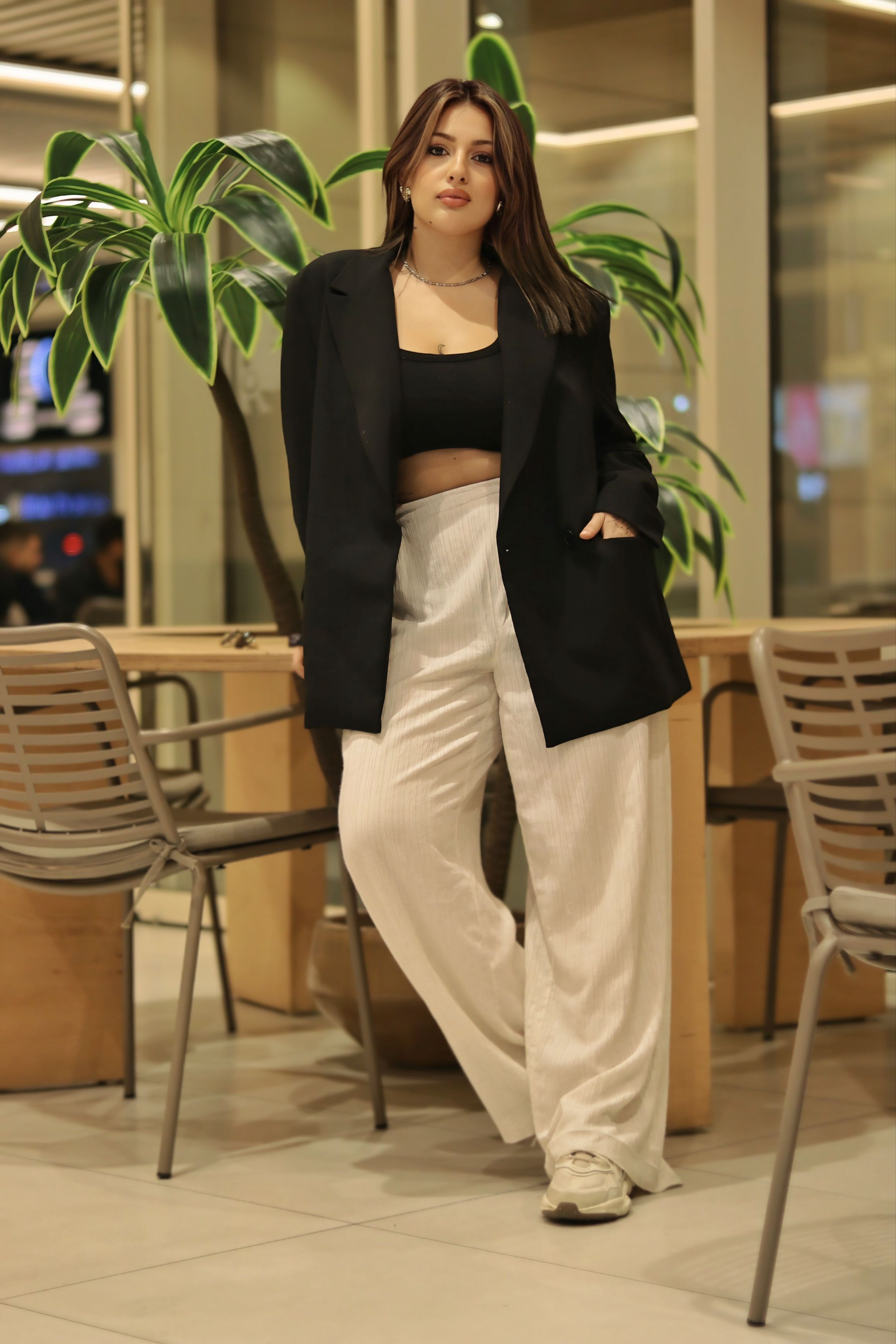 Fashionable Woman in Modern Indoor Setting · Free Stock Photo