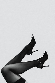 Black stiletto heels with elegant design captured in minimalist style, perfect for fashion themes.
