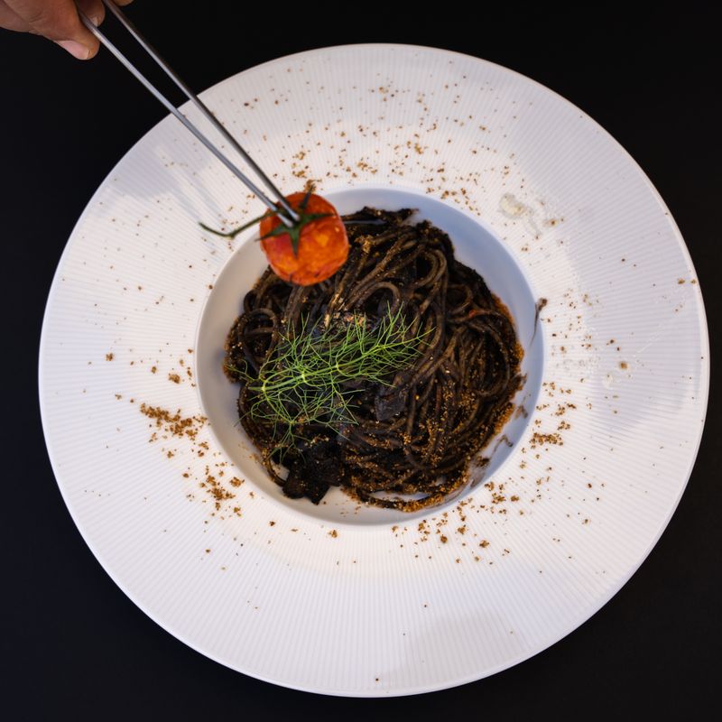Mediterranean Squid Ink and Tomato Chowder with Garlic