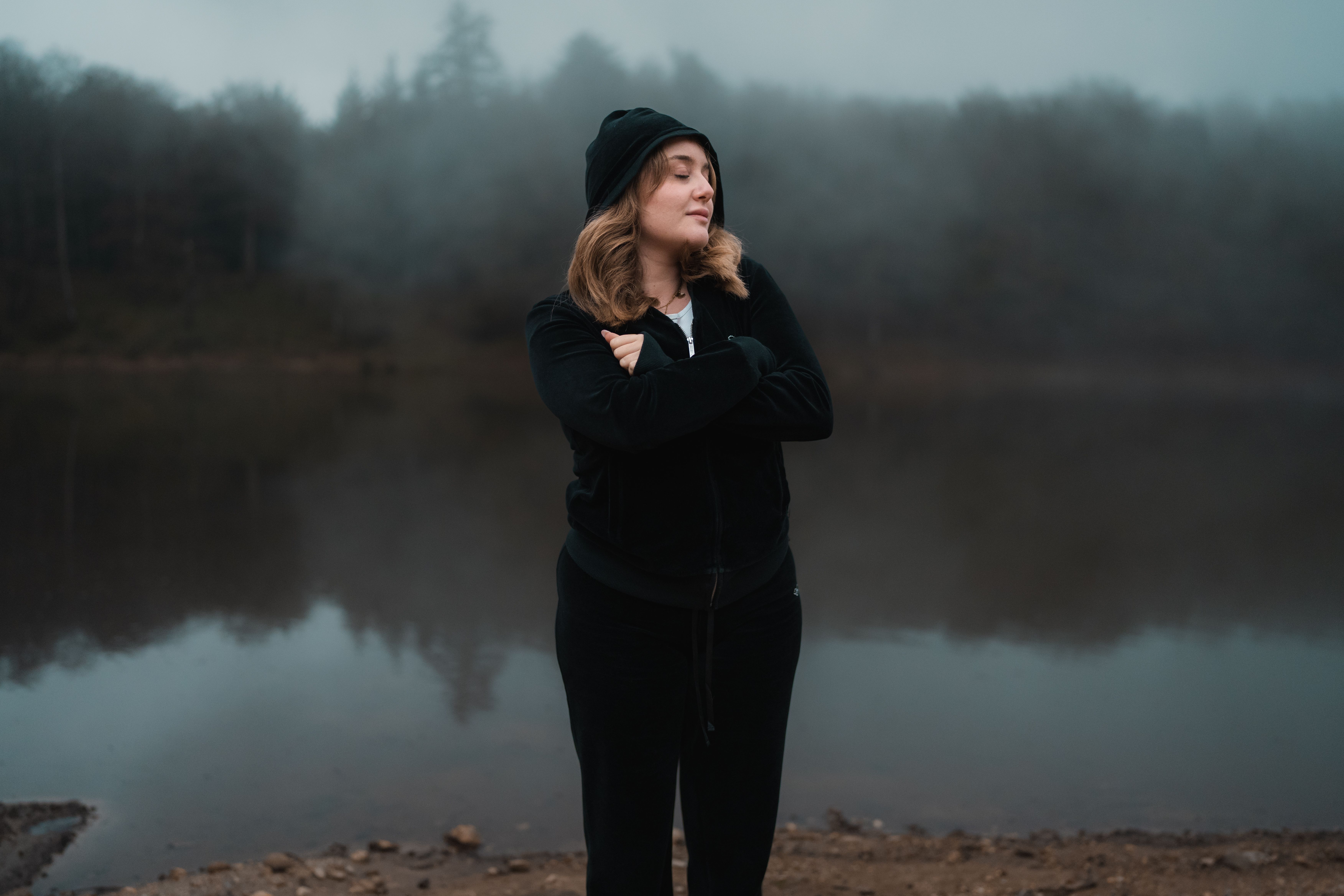 Woman in Black Outfit by Misty Lake · Free Stock Photo