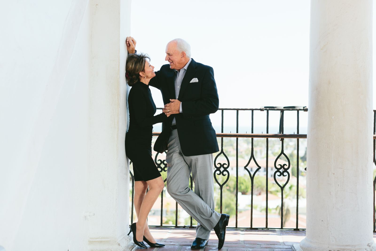 Senior couple enjoying a day at a picturesque balcony in Santa Barbara, California.