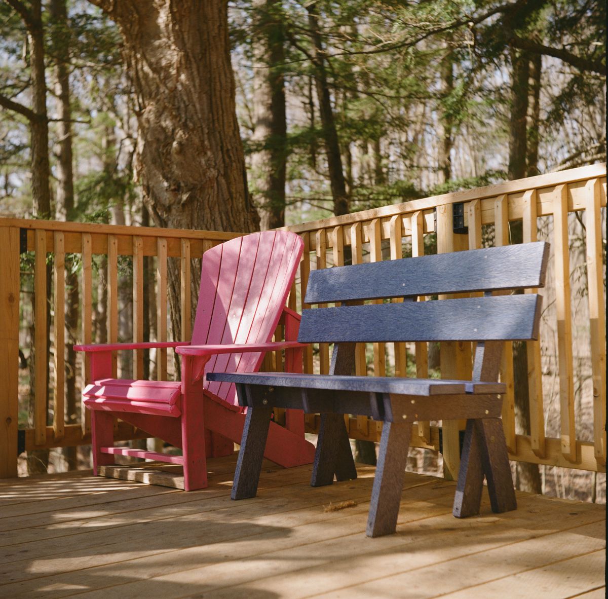 Outdoor deck seating in a wooded setting for everyday backyard relaxation