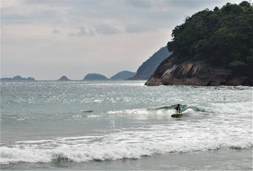 Photo of Person Surfing