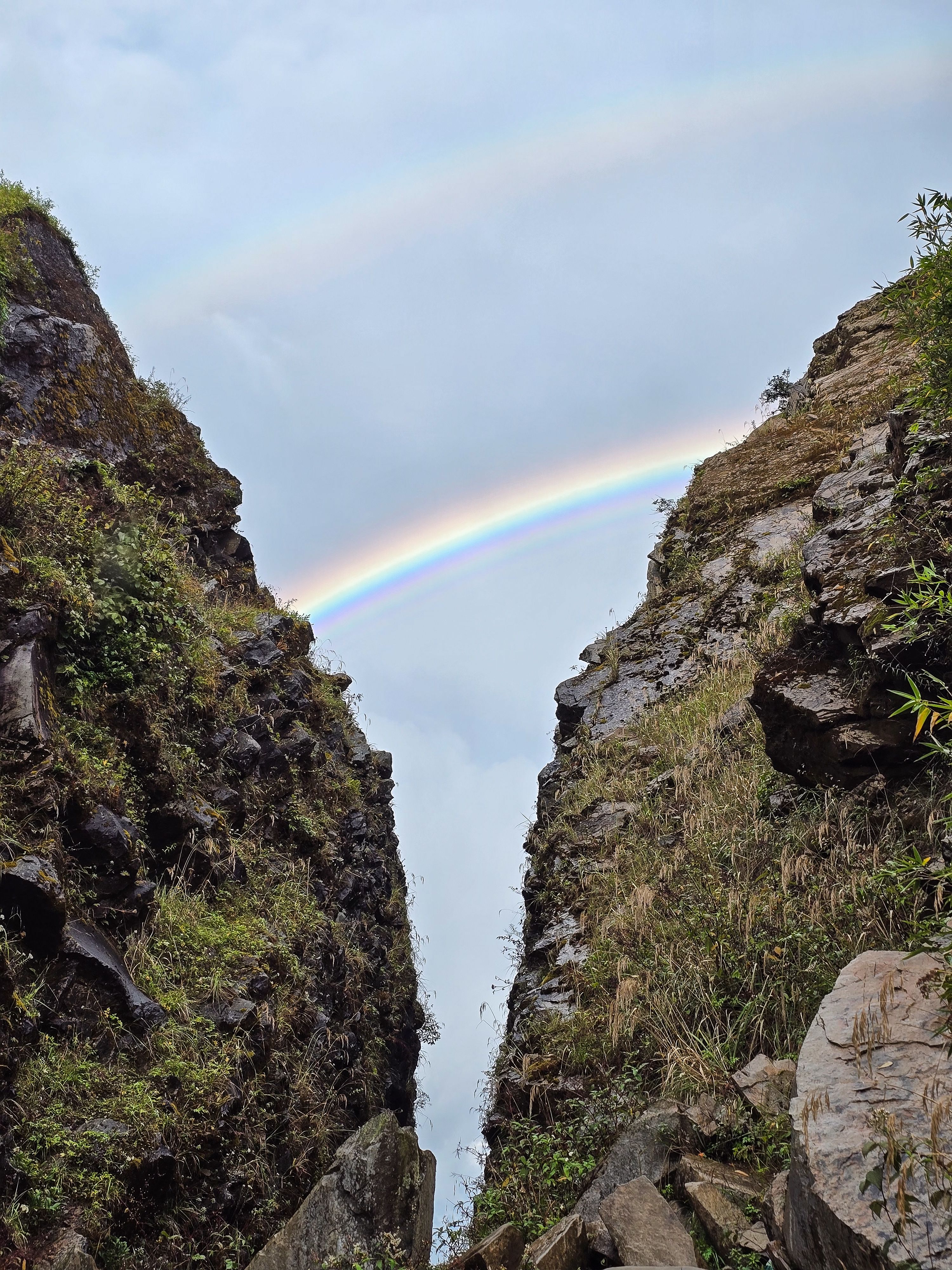 Majestic Double Rainbow Between Rocky Cliffs · Free Stock Photo