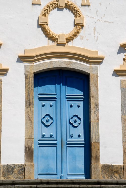 Free Blue colonial-style door with ornate details in Rio de Janeiro, Brazil, showcasing classic architecture. Stock Photo