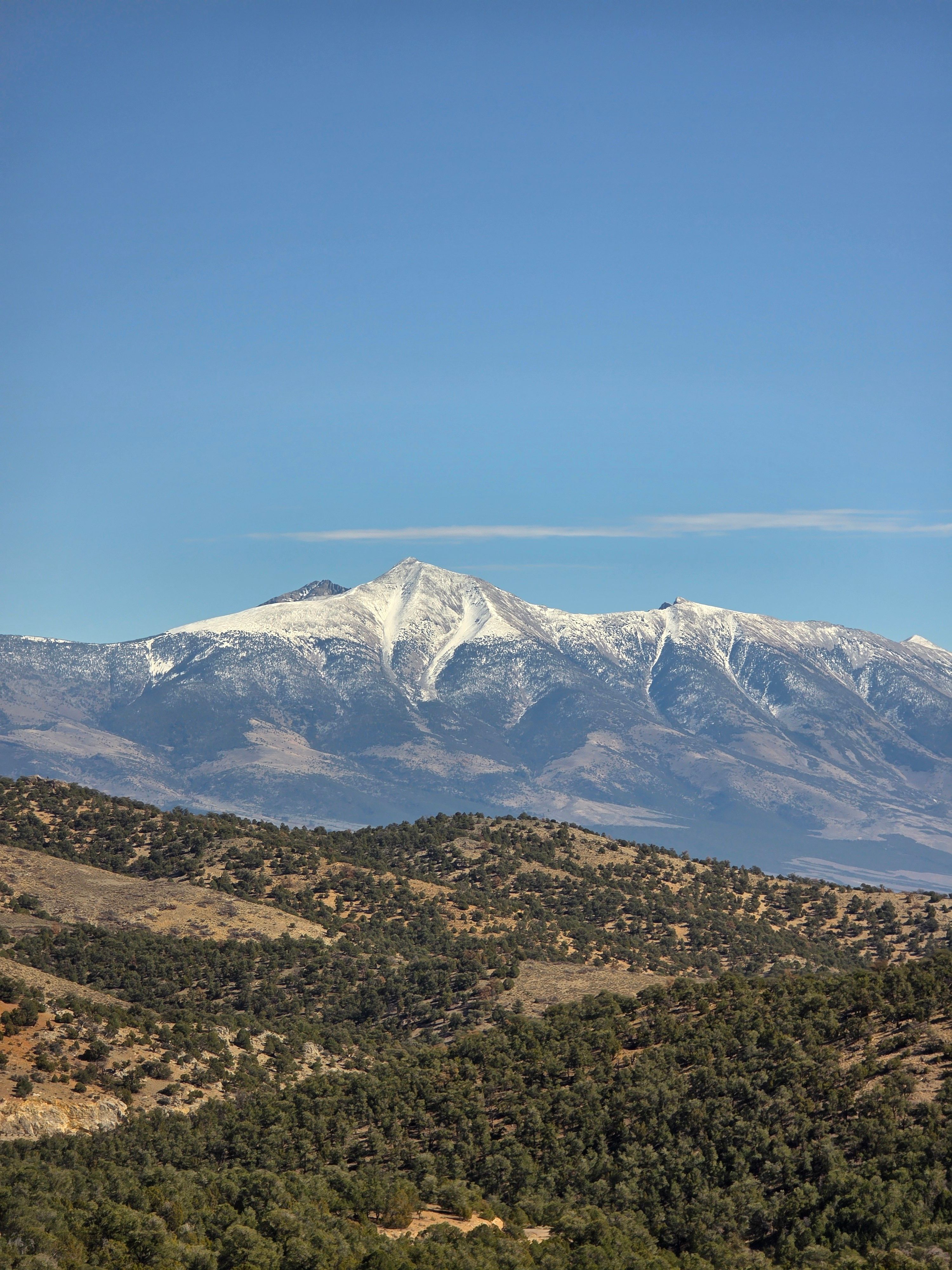 Snow-Capped Mountain Range Under Clear Blue Sky · Free Stock Photo