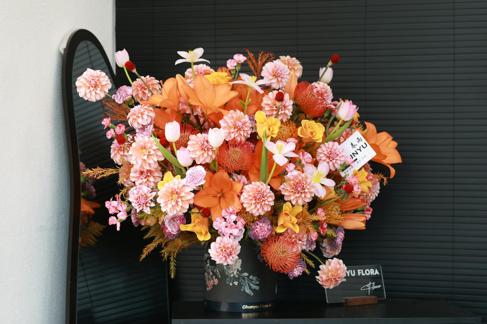 Vibrant mixed floral arrangement in a vase — joyful and generous