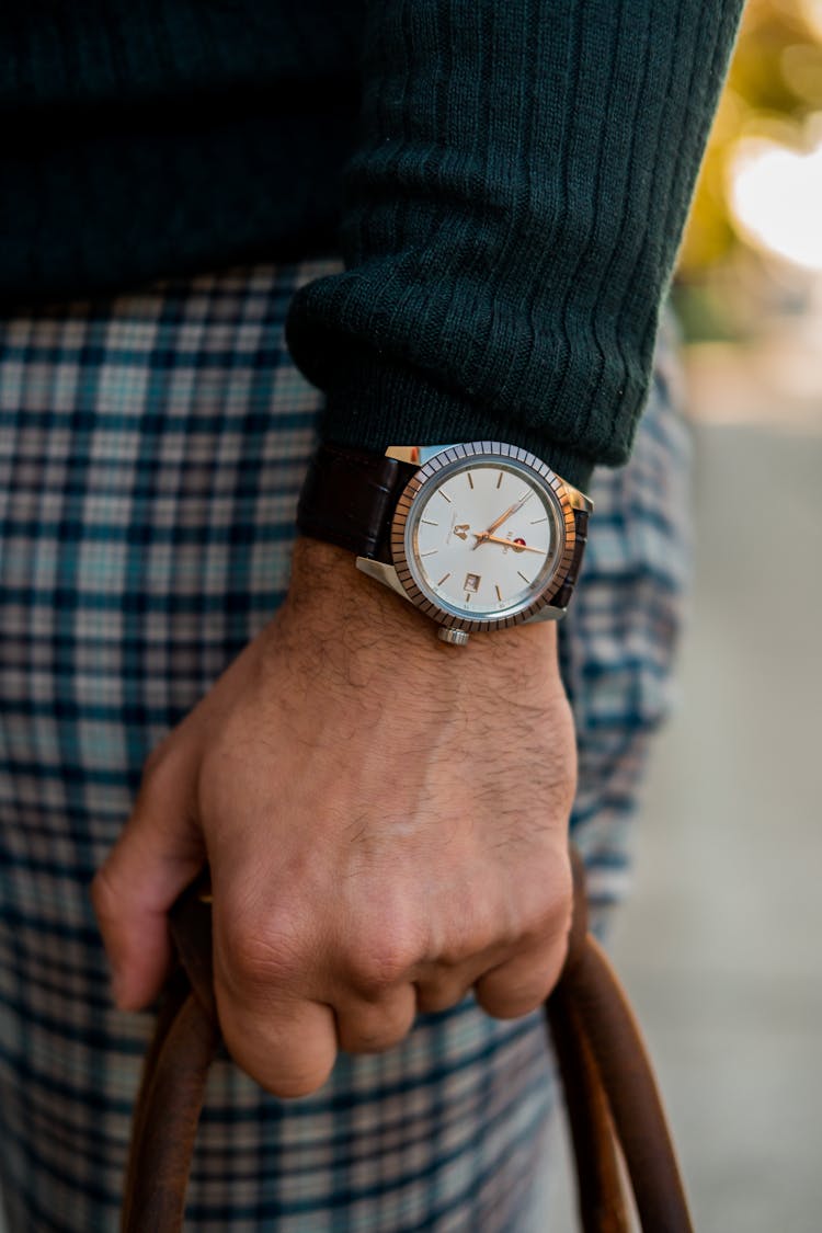 Person Wearing Black And Gold Analog Watch