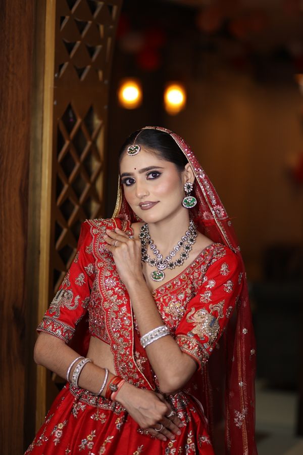 Indian bride in richly embroidered traditional wedding attire
