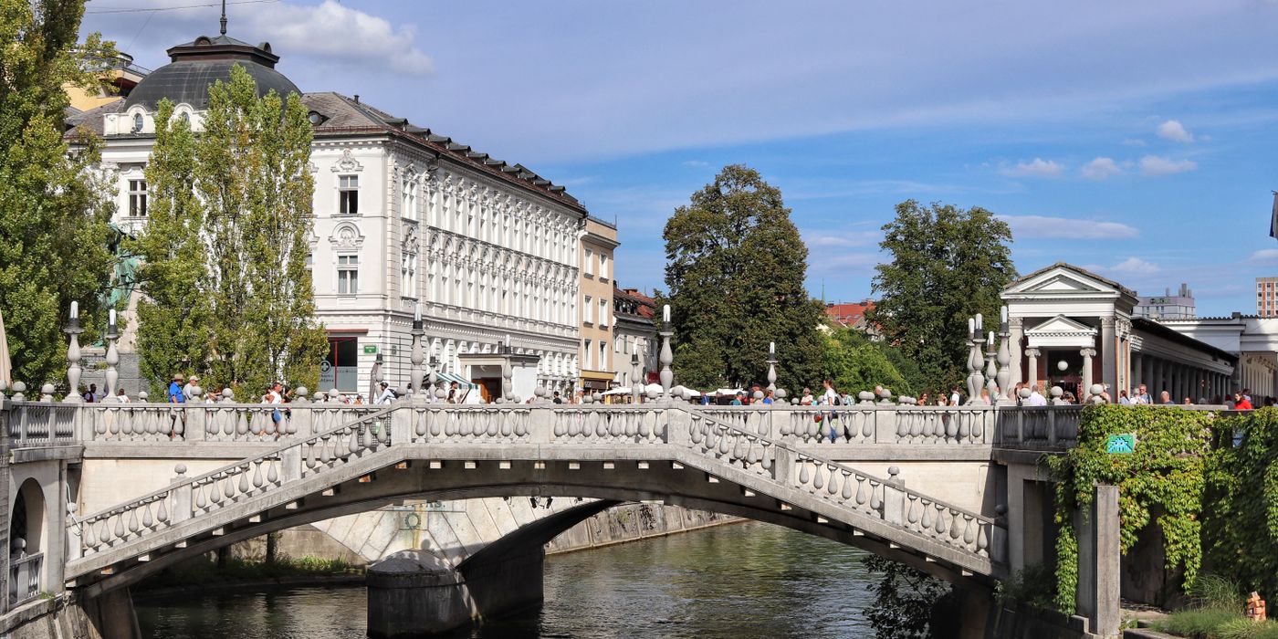 The Triple Bridge over the Ljubljanica river on a sunny day in Ljubljana