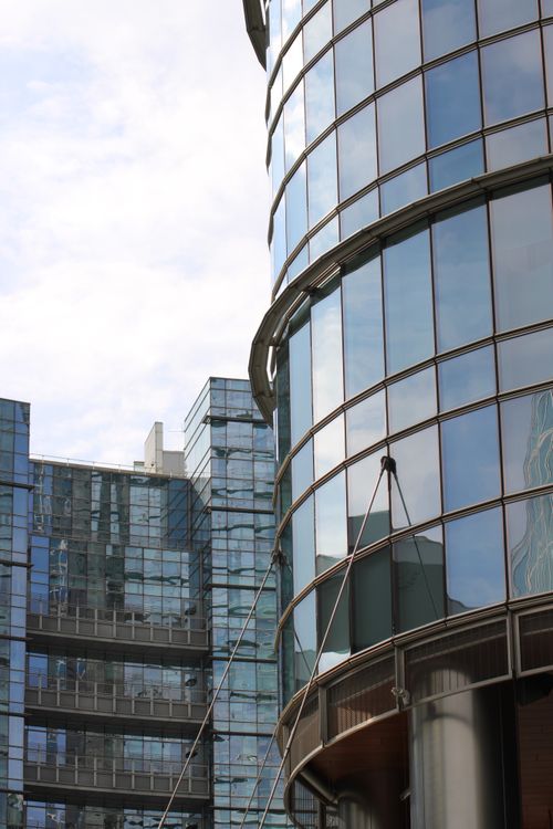 Free Close-up of modern skyscrapers in Milan's stylish Porta Garibaldi district under a bright sky. Stock Photo