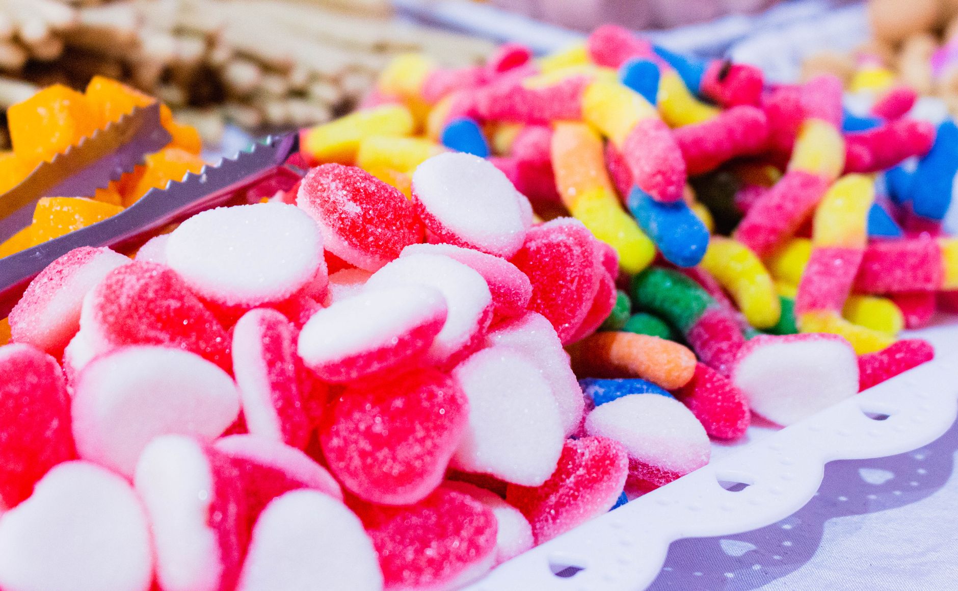 Close-up of a vibrant assortment of gummy candies displayed on a table.
