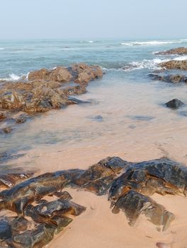Tranquil coastal view in Casablanca, Morocco, featuring rocky shores and crystal-clear sea waves.