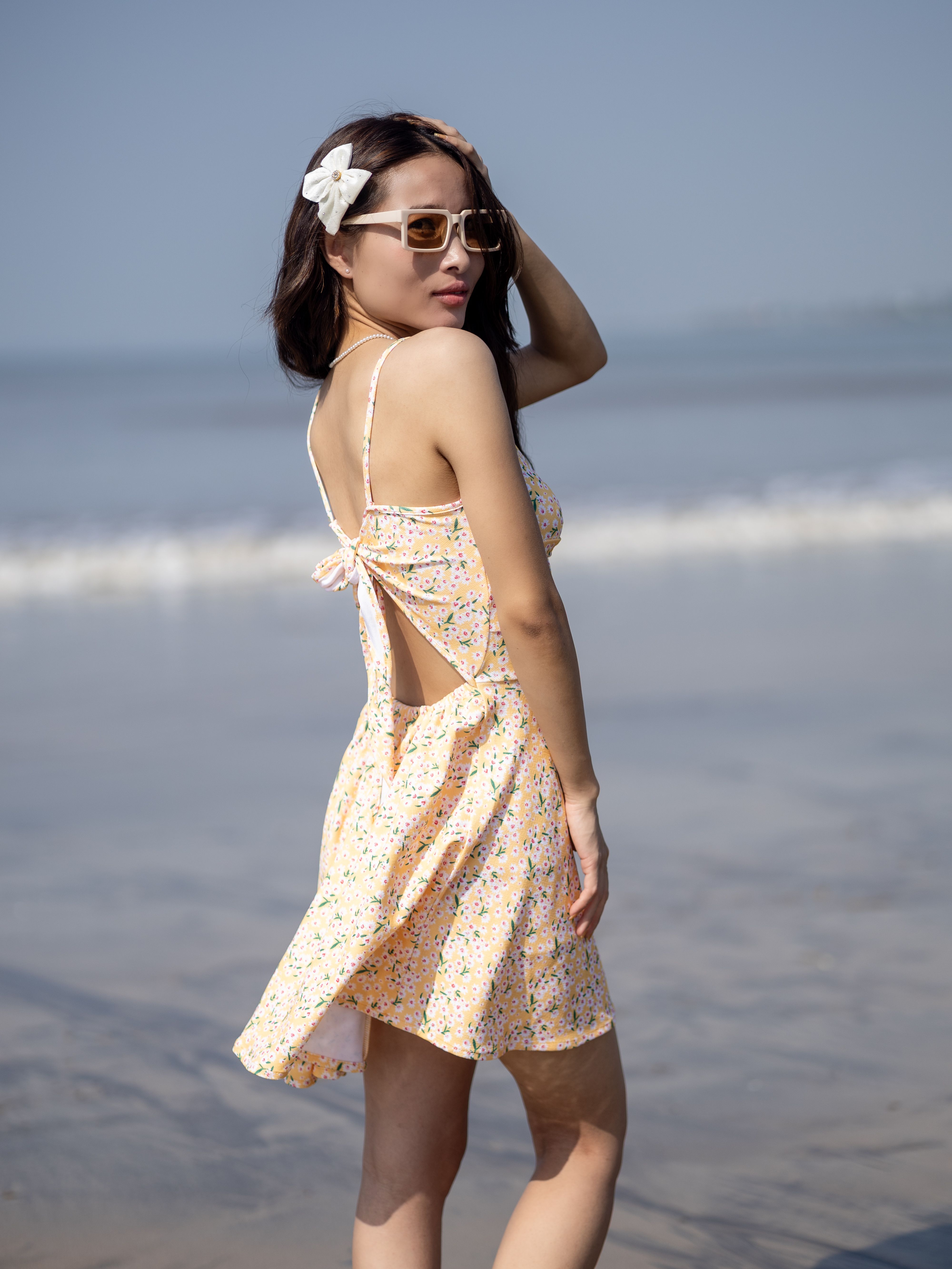 Woman in Summer Dress Posing on Beach · Free Stock Photo