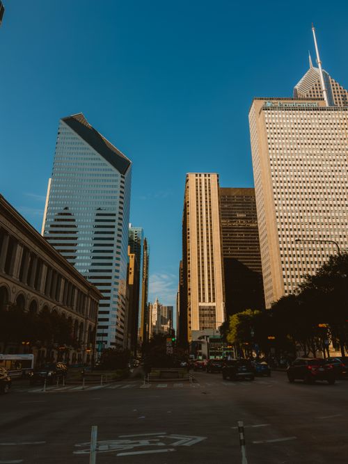 Free Urban street view showcasing modern skyscrapers and blue skies. Stock Photo