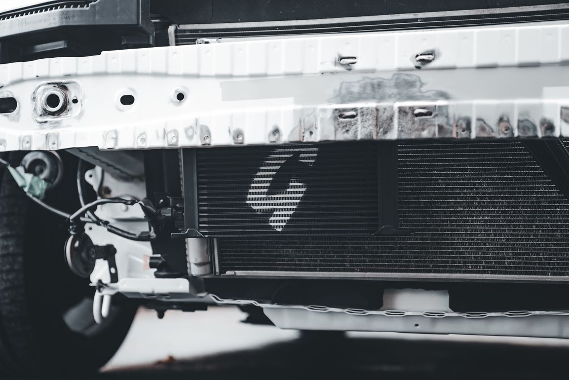 Close-up of Car Radiator and Front Bumper Detail · Free Stock Photo