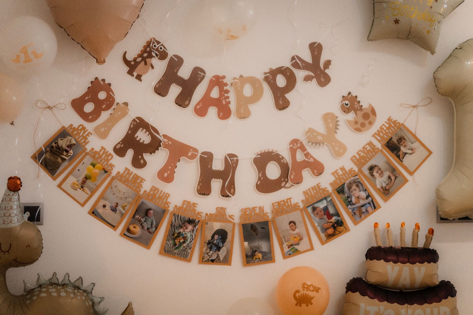 Dinosaur themed first birthday party decoration with balloons