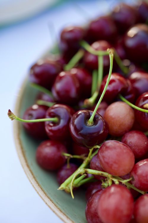 Free Close-up of fresh red cherries in a bowl, perfect for summer themes. Stock Photo