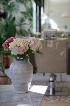 Elegant salon interior with chic floral arrangement in focus.