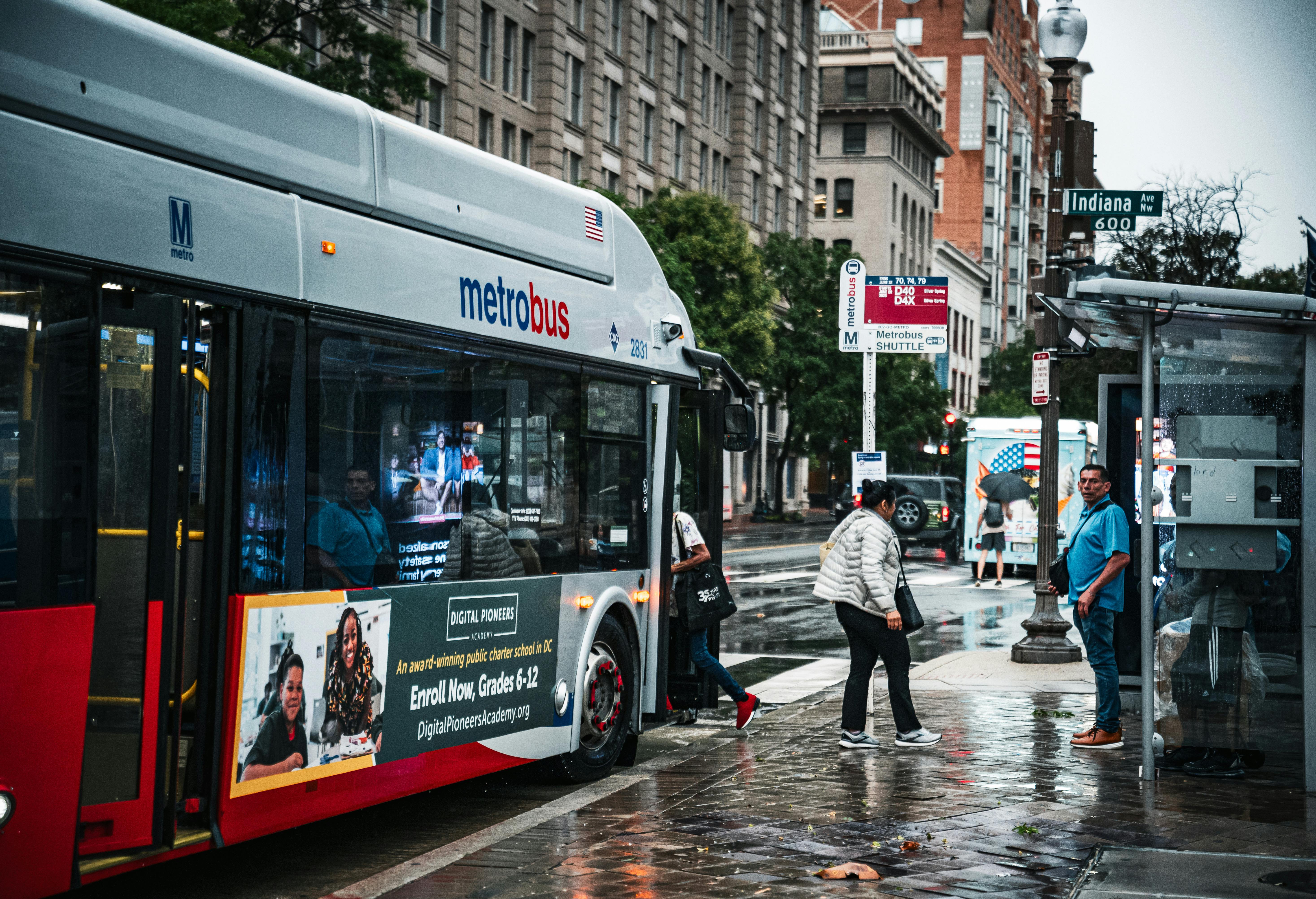 Vivid street photography capturing a wet day with a Metrobus on Indiana Ave, Washington D.C.
