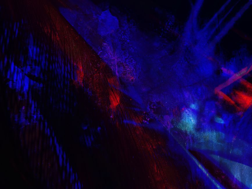 Dynamic abstract art piece with vibrant blue and red colors creating a bold visual effect.
