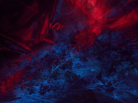 Dynamic abstract artwork with deep red and blue colors, offering a modern art vibe.