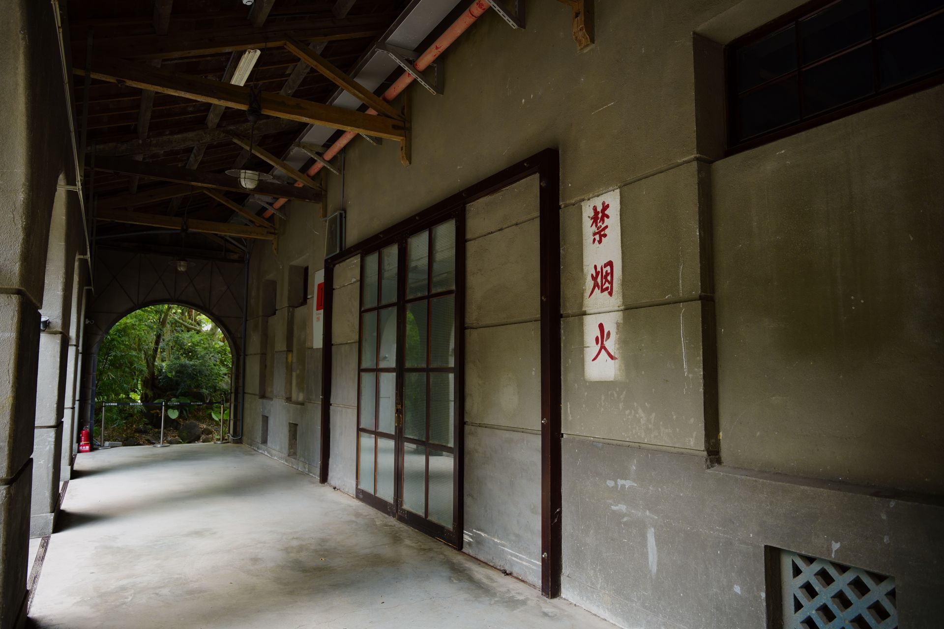 Explore the vintage architectural corridor with traditional Chinese No Smoking sign in Taipei, Taiwan.