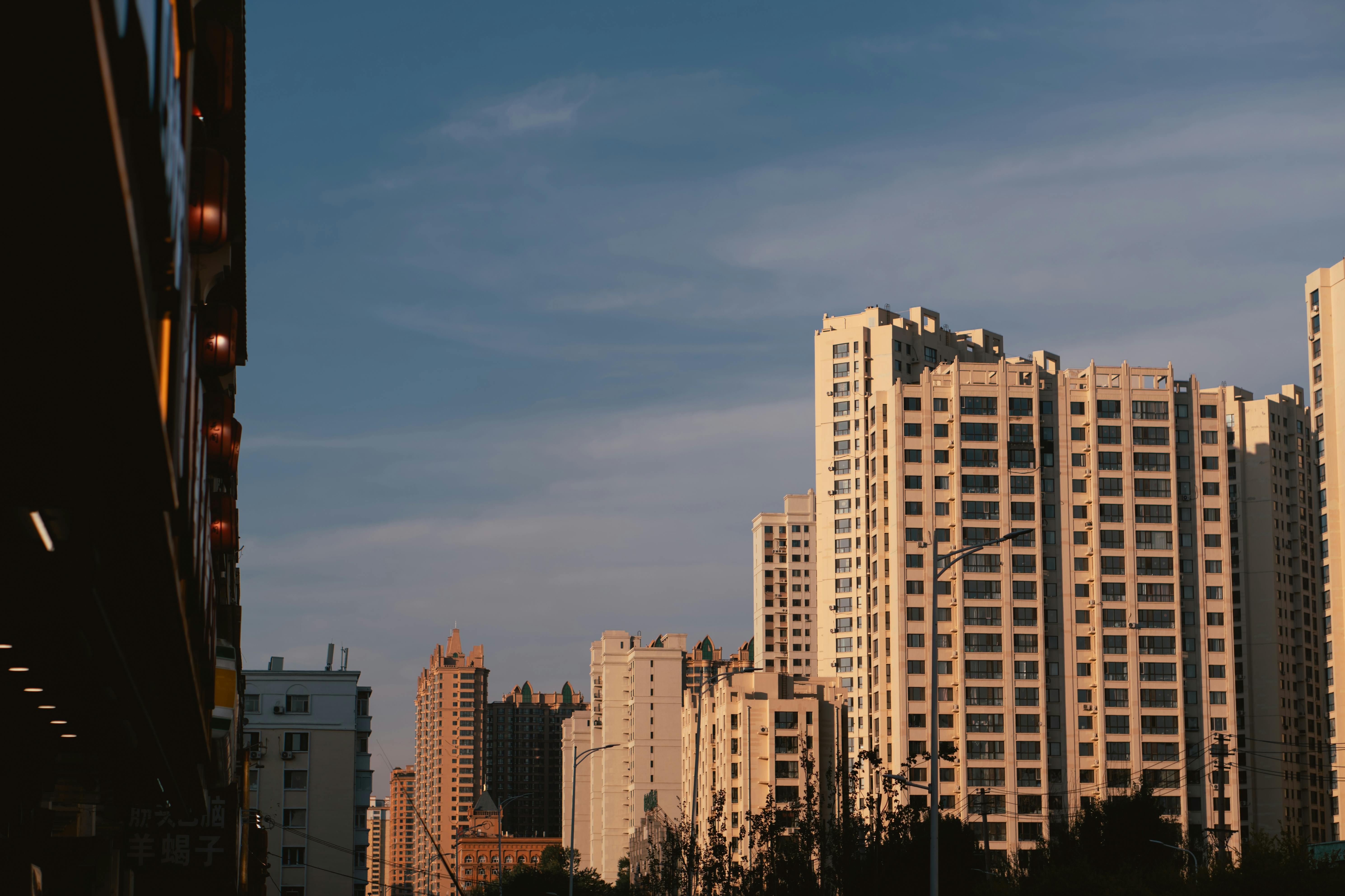 Warm Sunset Light on Modern Residential Towers and Urban Street