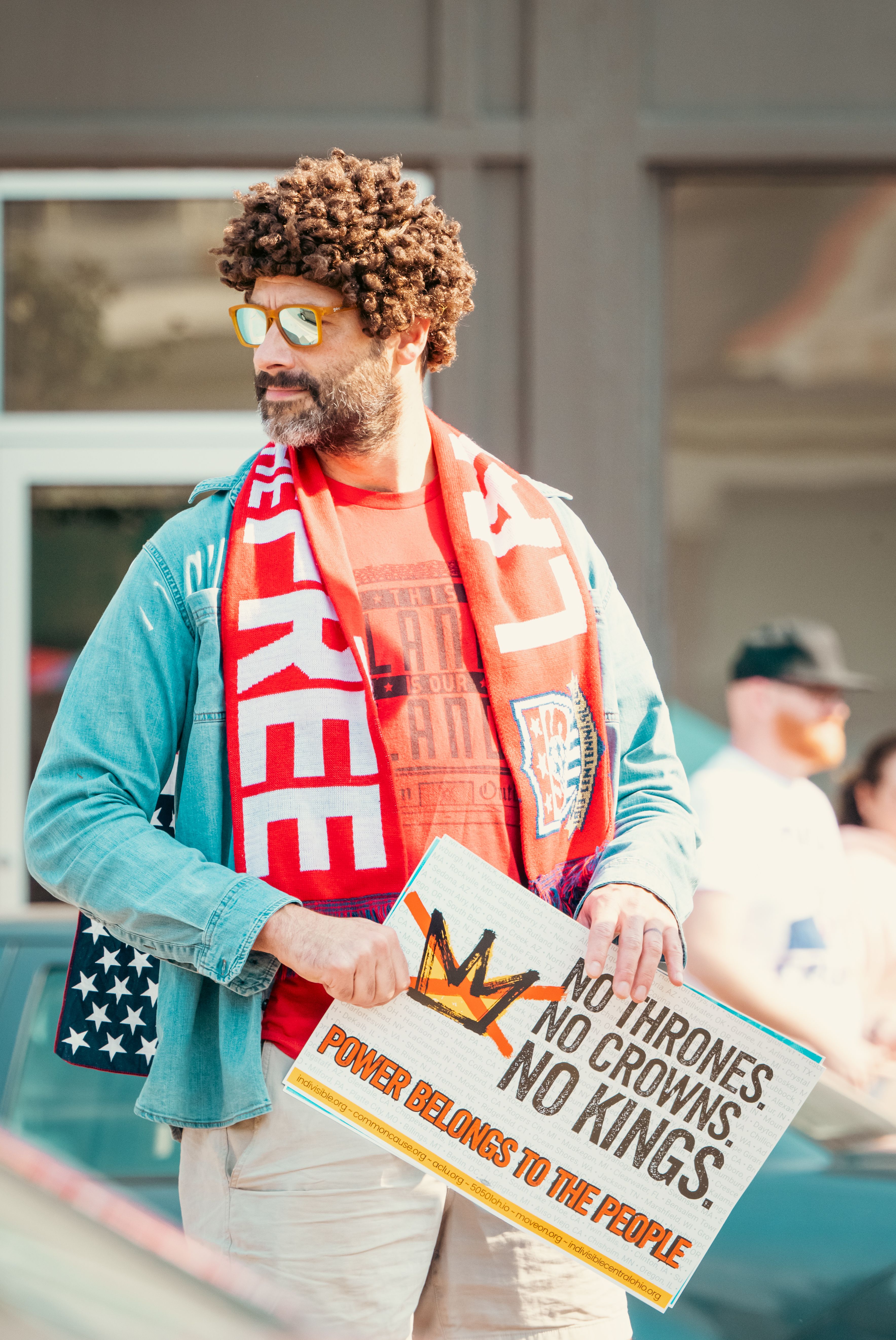 Protestor holding sign at outdoor demonstration · Free Stock Photo