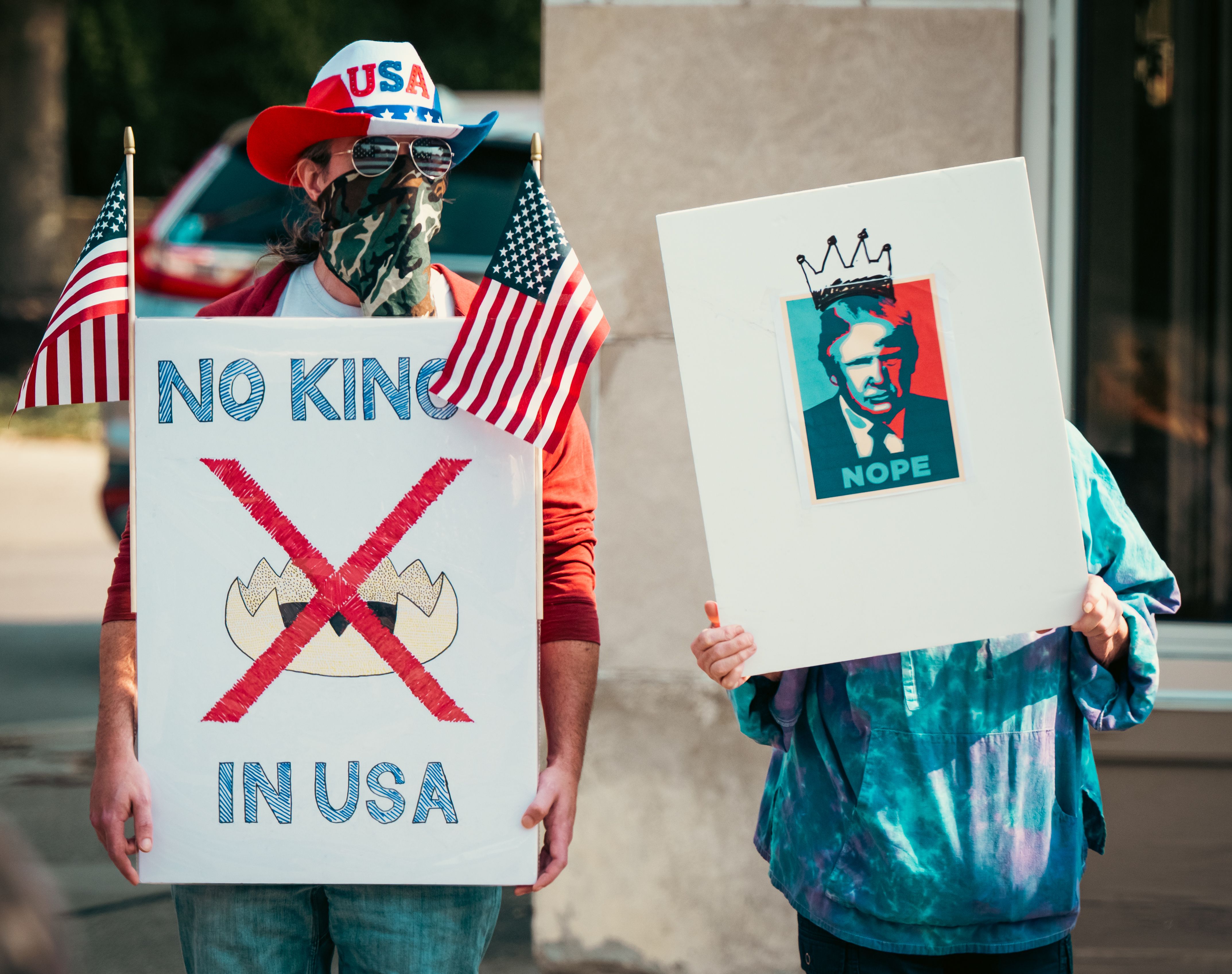 Protesters Holding Signs with Political Messages · Free Stock Photo
