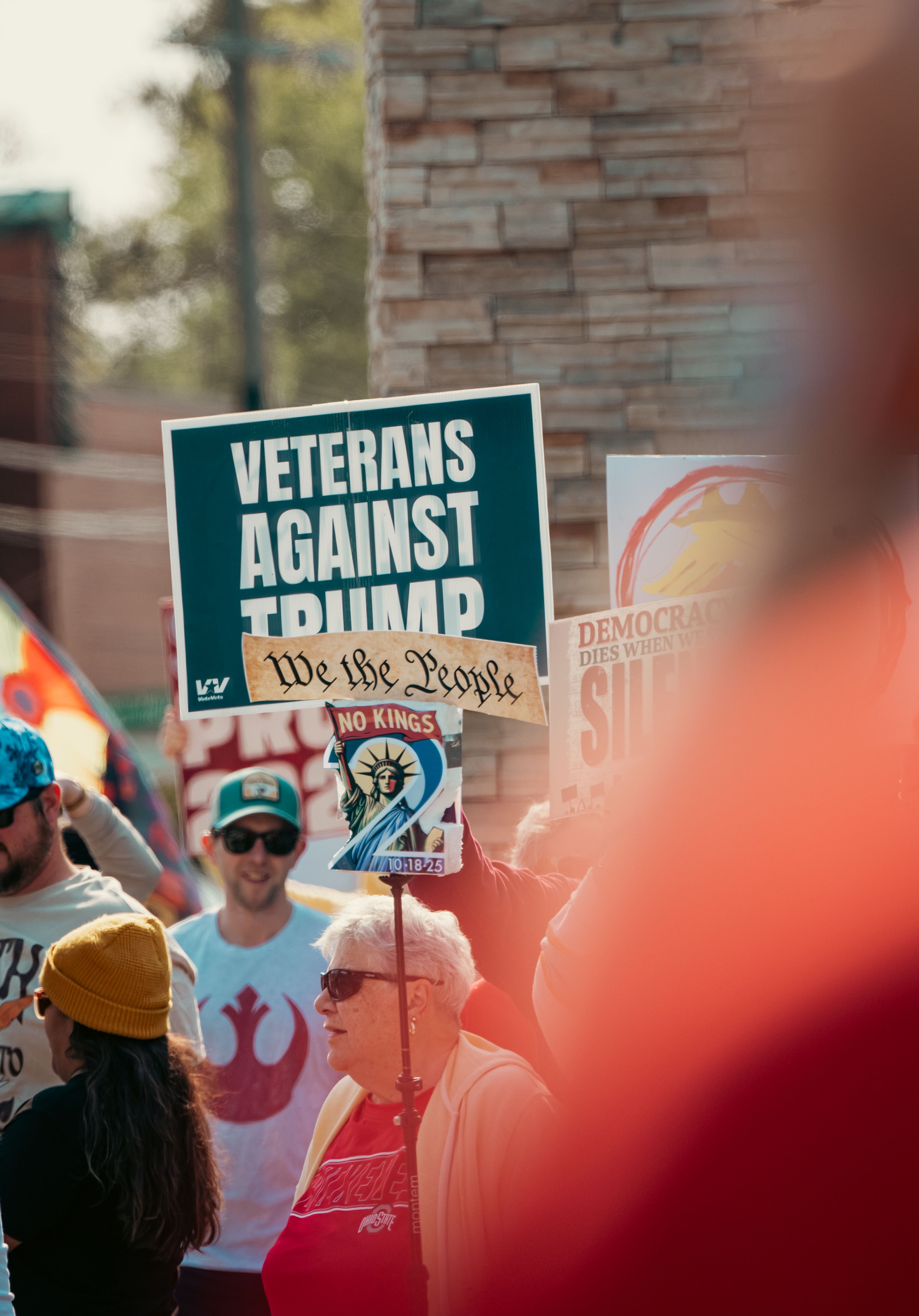 Protesters Holding Political Signs at Rally · Free Stock Photo