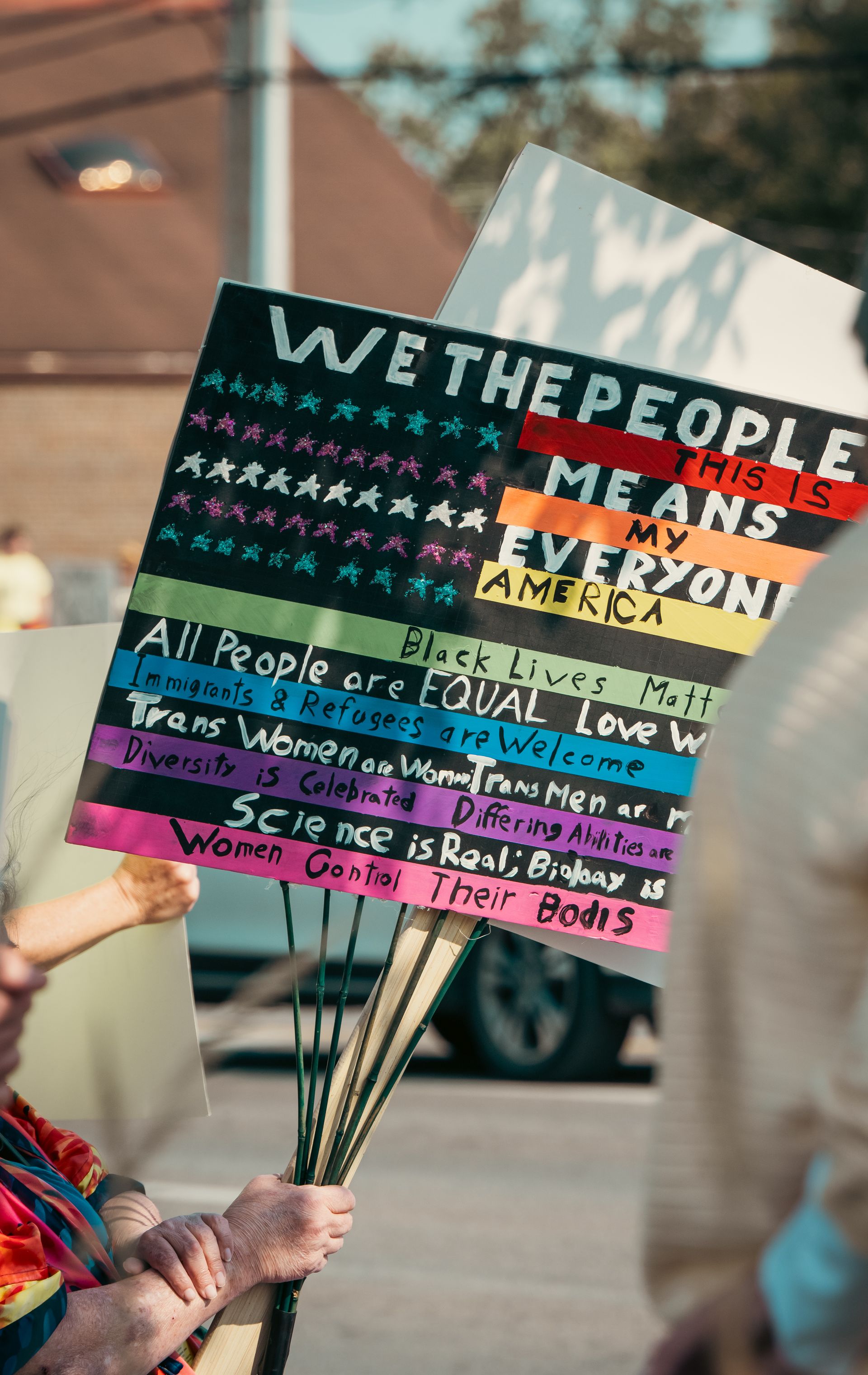 Protest sign advocating equality and acceptance for immigrants — ICE raids and immigrant c
