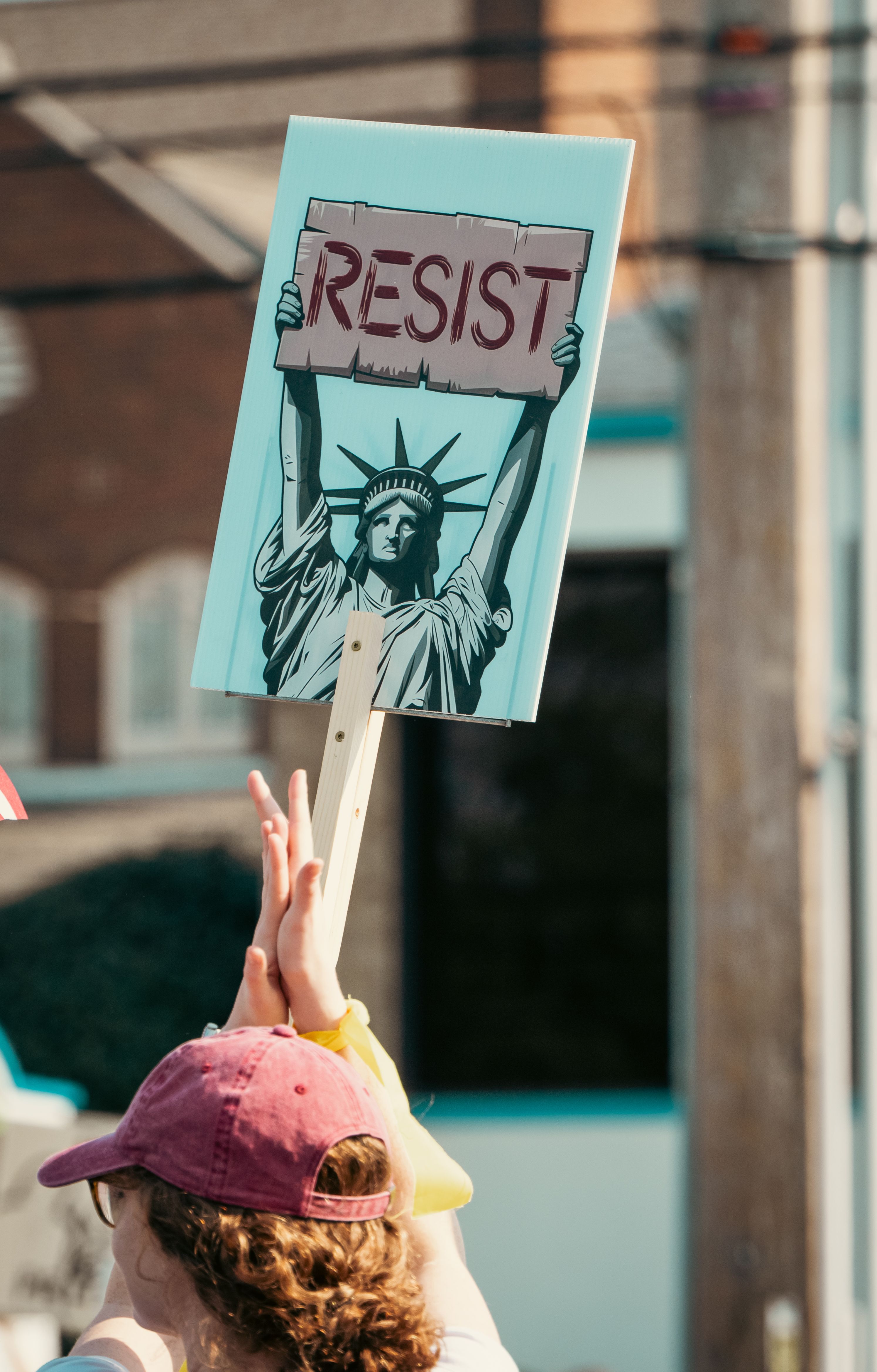 Protest Sign Featuring Statue of Liberty and 'Resist' · Free Stock Photo