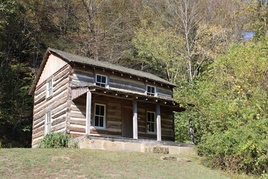 Rustic log cabin nestled among autumn trees in Ohio, USA. Perfect for nature lovers.