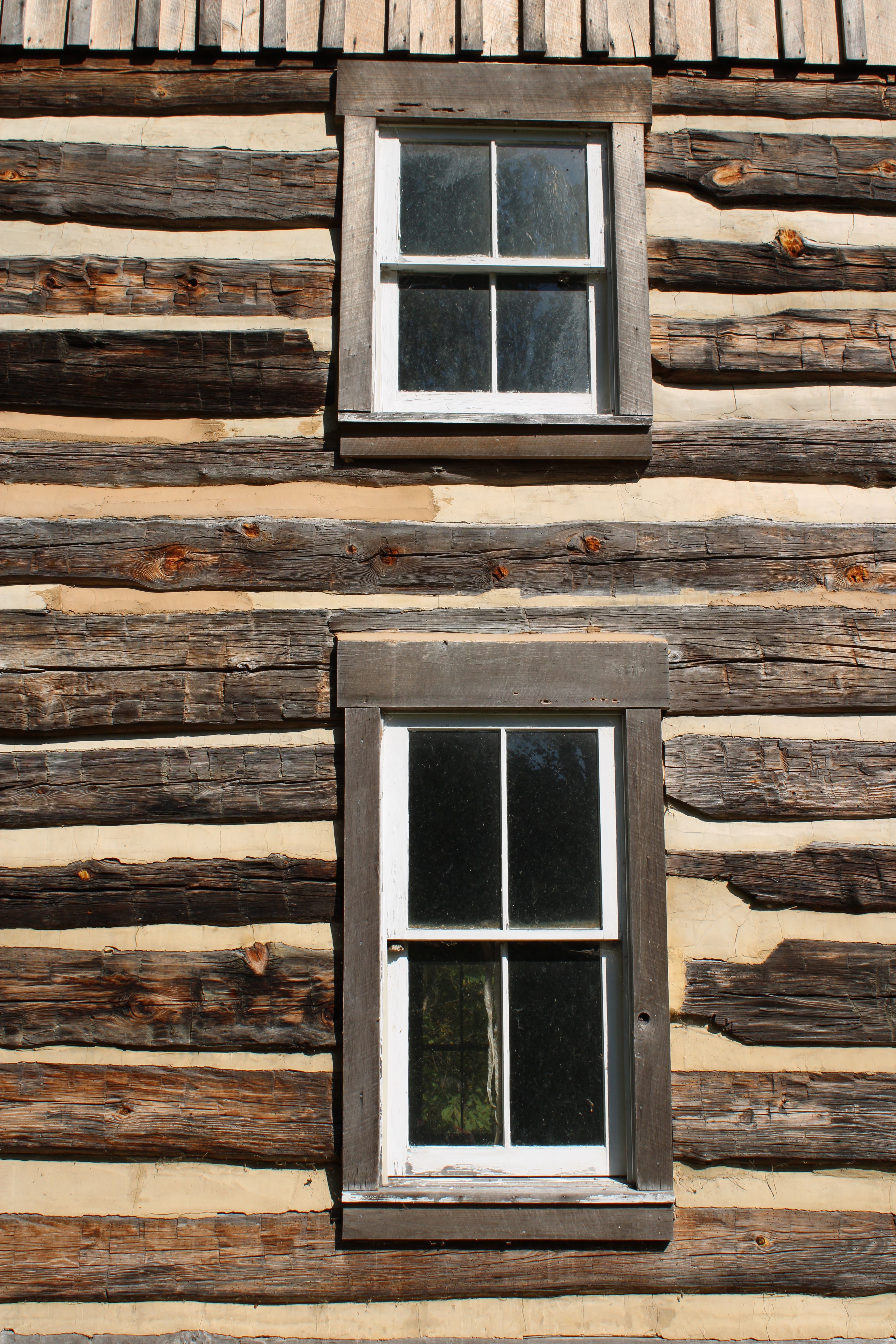 Rustic Log Cabin with Traditional Windows · Free Stock Photo