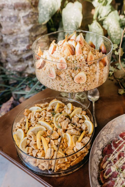 Free High-angle view of gourmet dishes featuring figs and chicken with garnish, perfect for a culinary event. Stock Photo