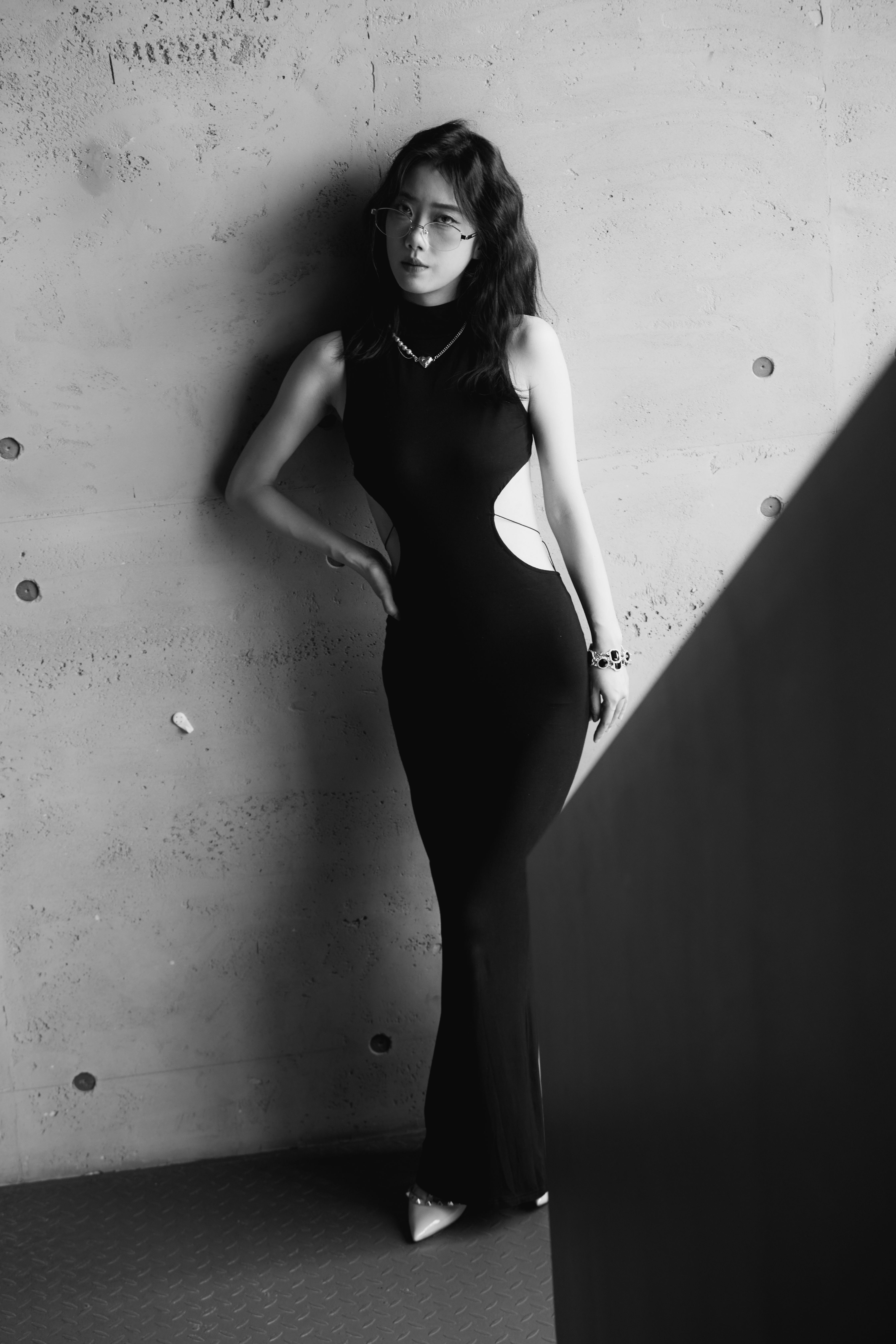 Elegant Woman in Black Dress Posing Indoors · Free Stock Photo