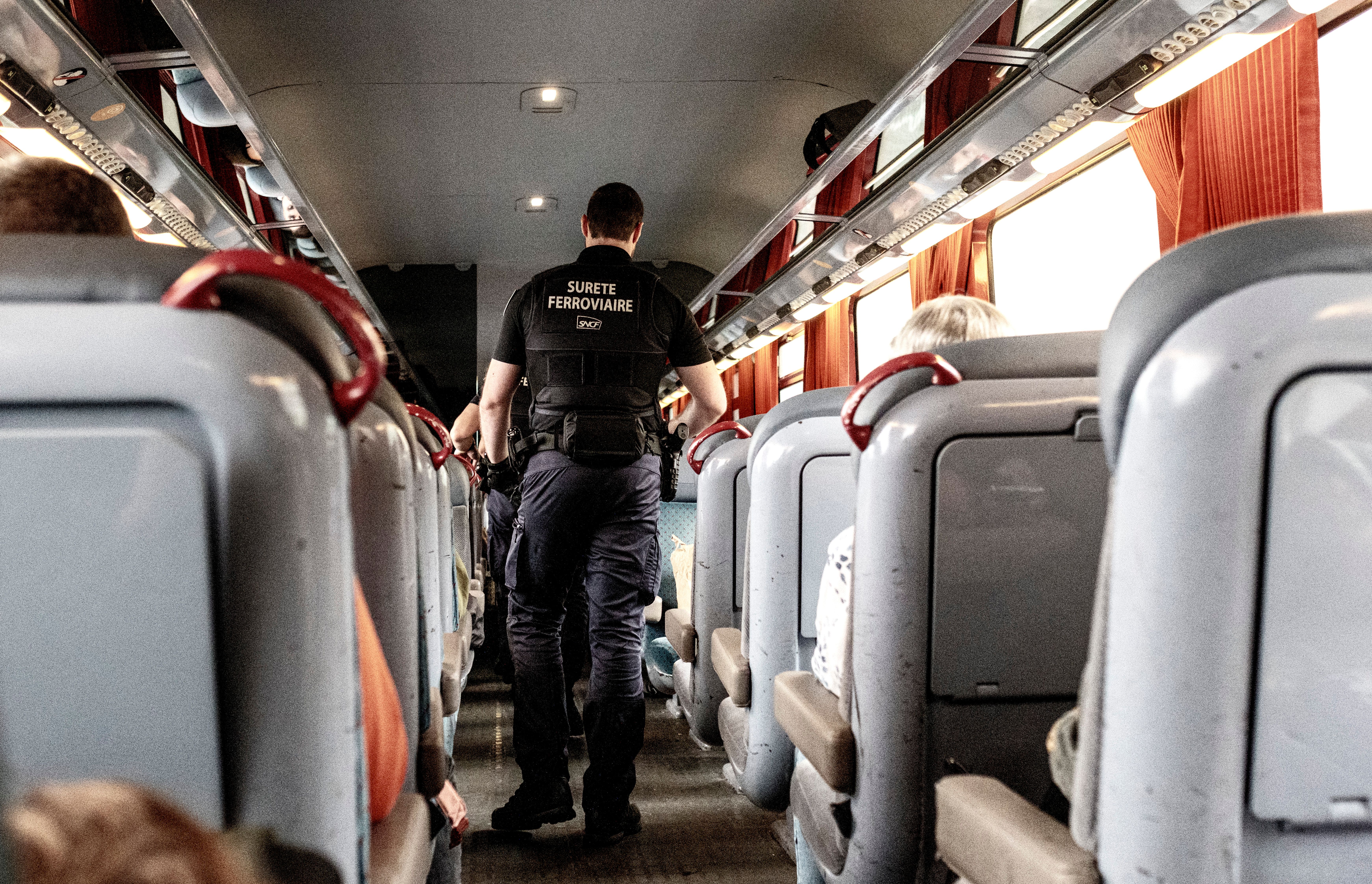 Security Personnel on a French Train Interior · Free Stock Photo