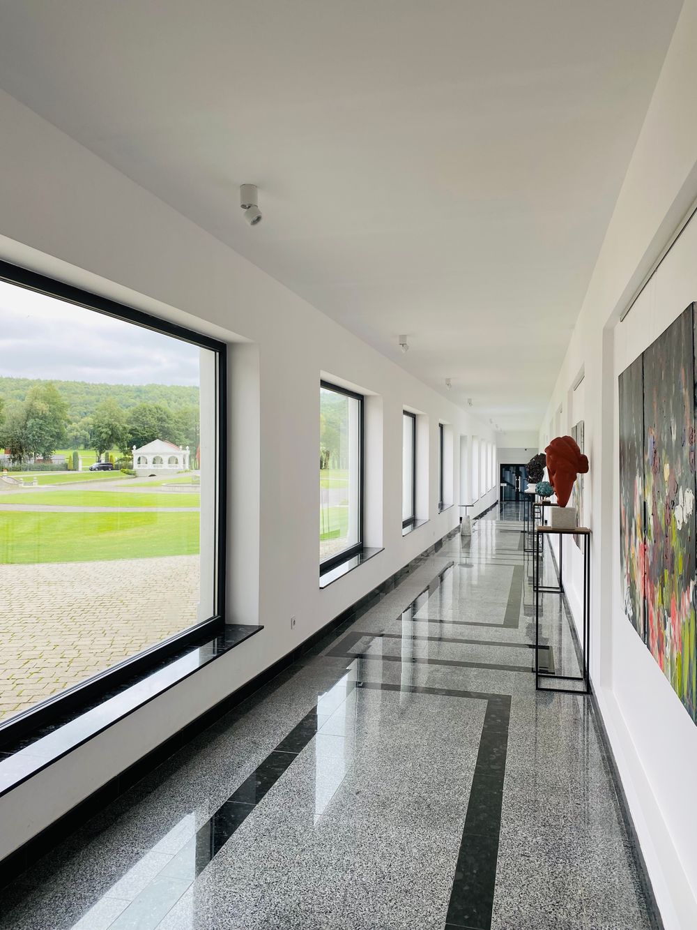 Long glazed corridor, photo by Vitaliy Bratkov on Pexels