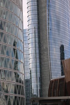 Close-up view of modern glass skyscrapers in Porta Garibaldi, Milan, Italy.