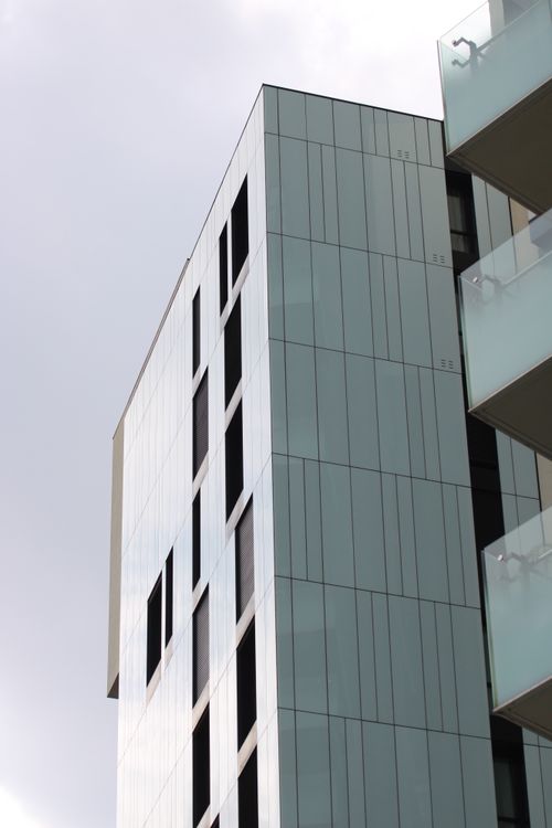 Free Sleek modern skyscraper with glass facade in Milan's Porta Garibaldi, Italy. Stock Photo